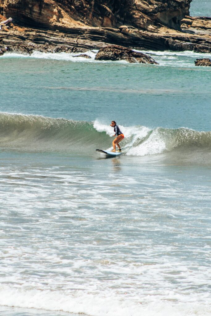 Woman surfing in Nicaragua